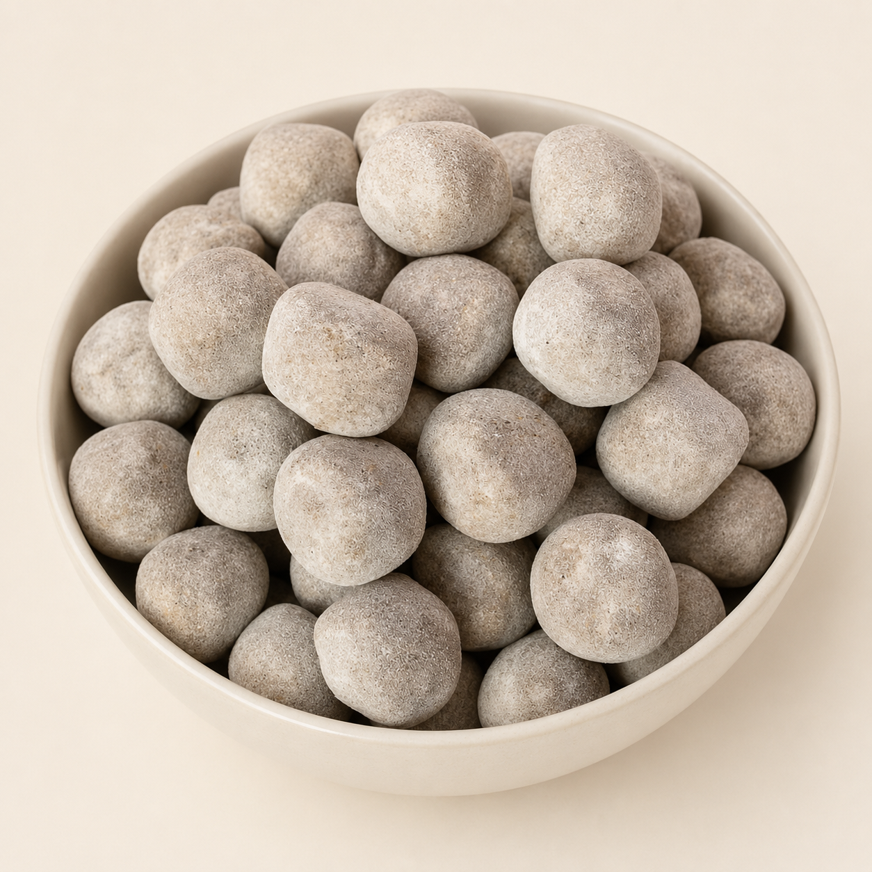GovindJee sweet and tangy Ram Laddu mukhwas in an ivory ceramic bowl