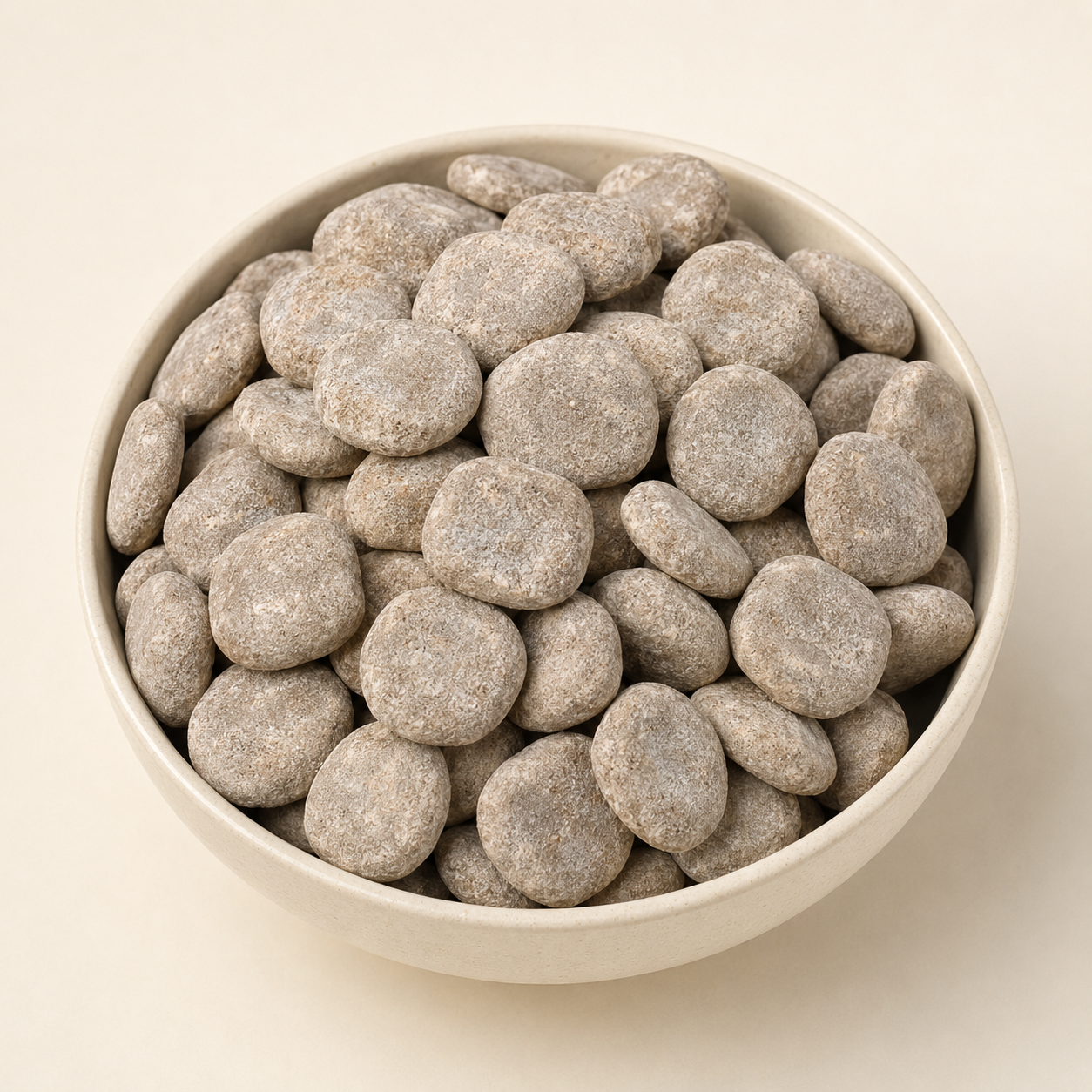GovindJee Hing Peda digestive candy in a ceramic bowl