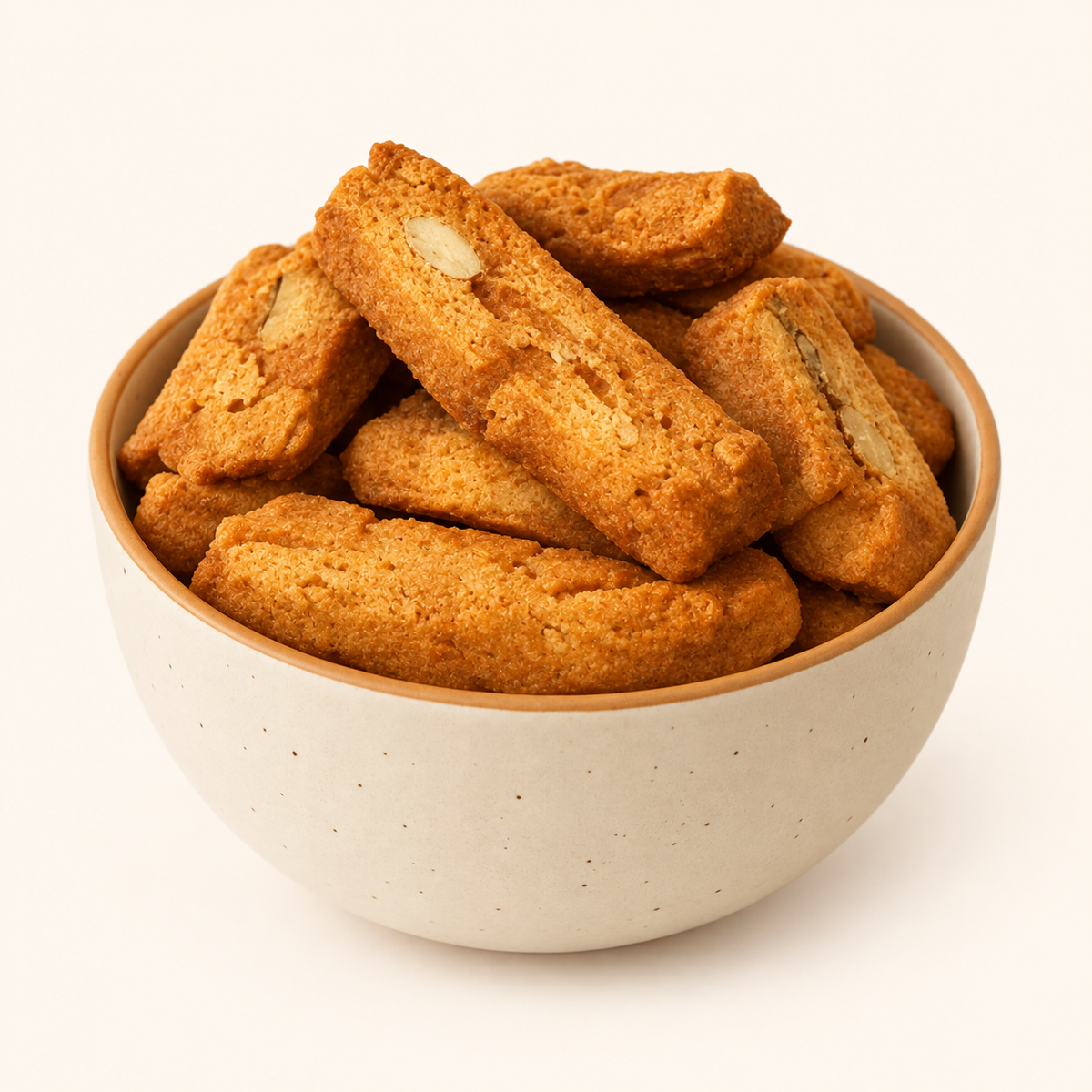 Almond Biscotti in an ivory bowl on an off-white background