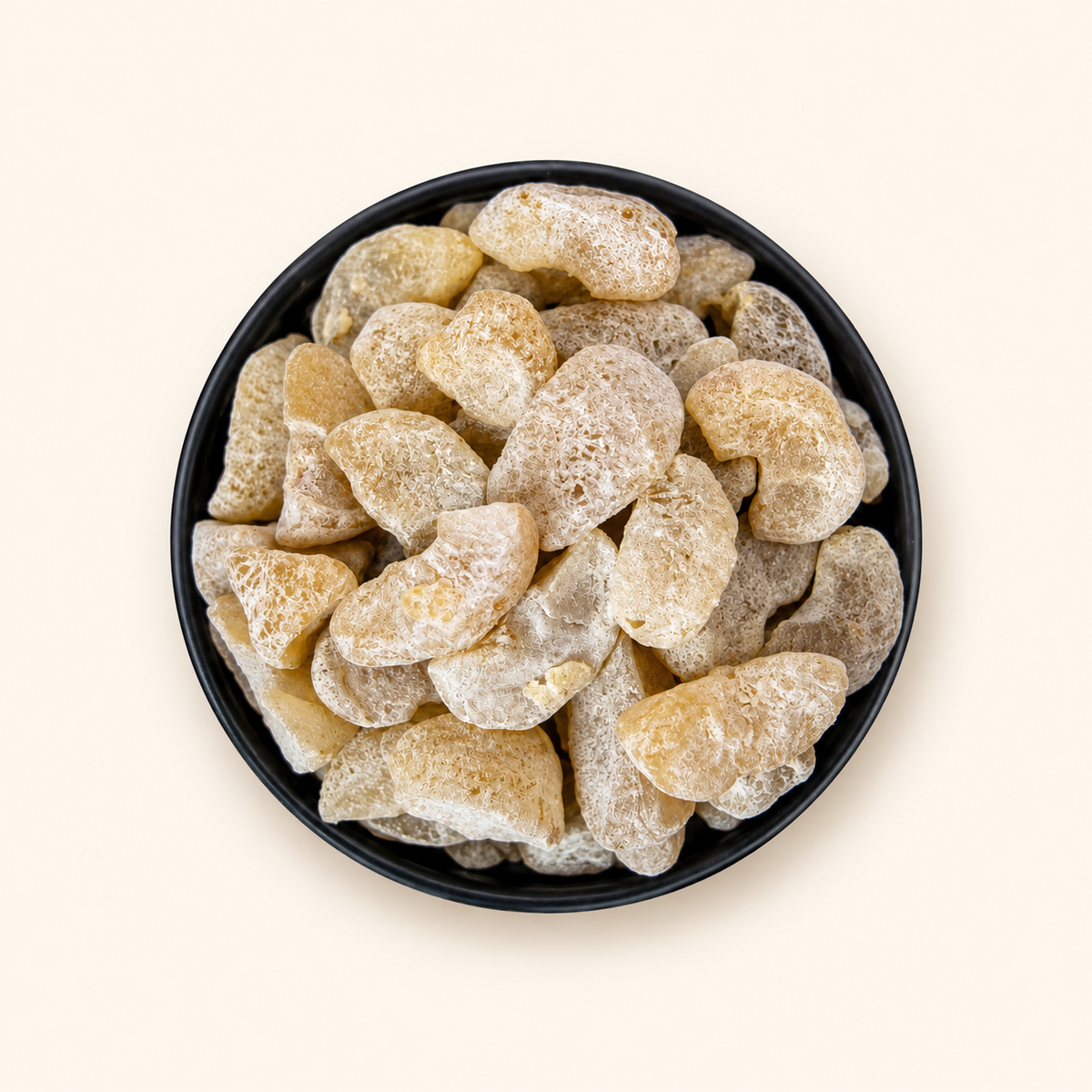 Amla Sweet in a bowl on an off-white background