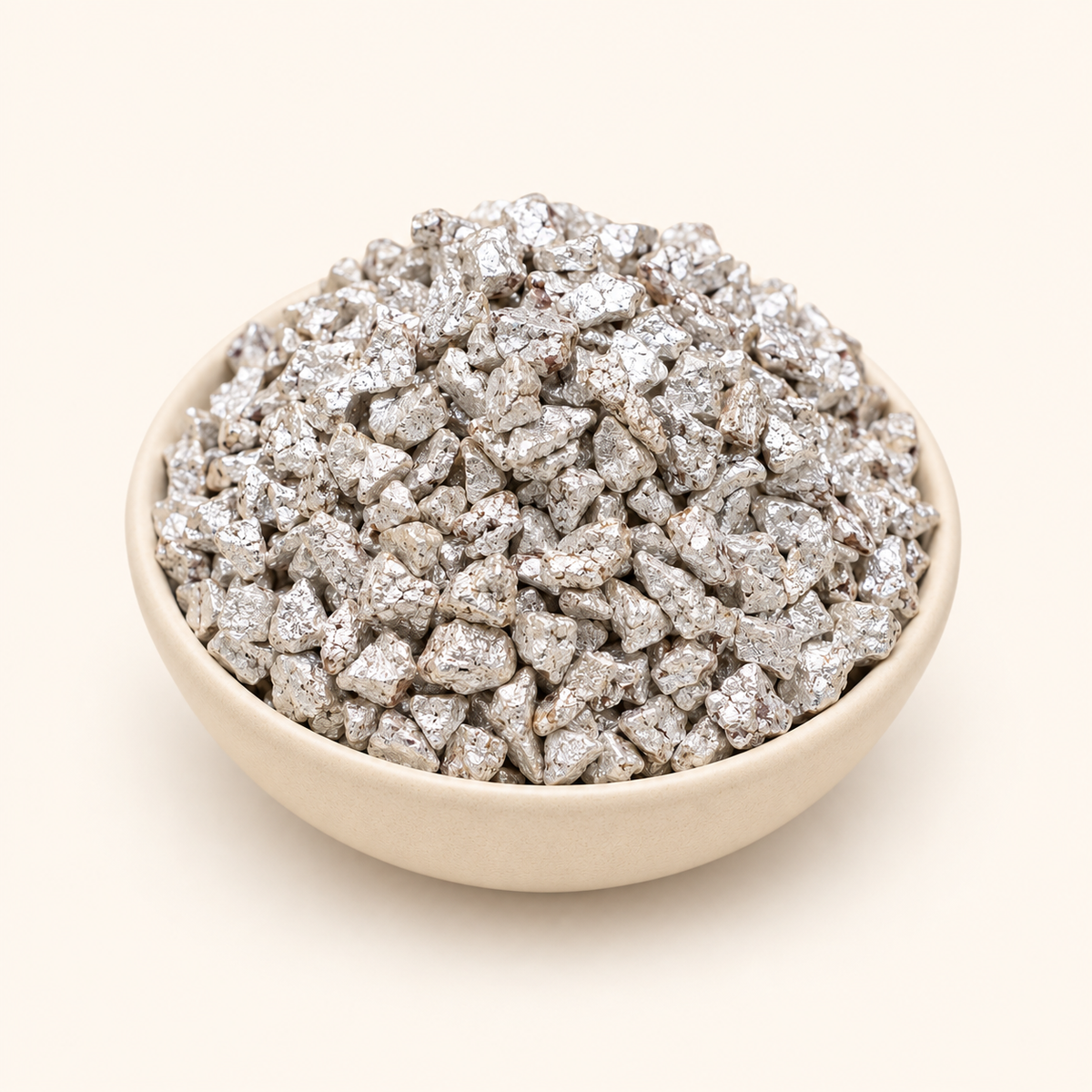 Khus Supari Silver in a bowl on an off-white background