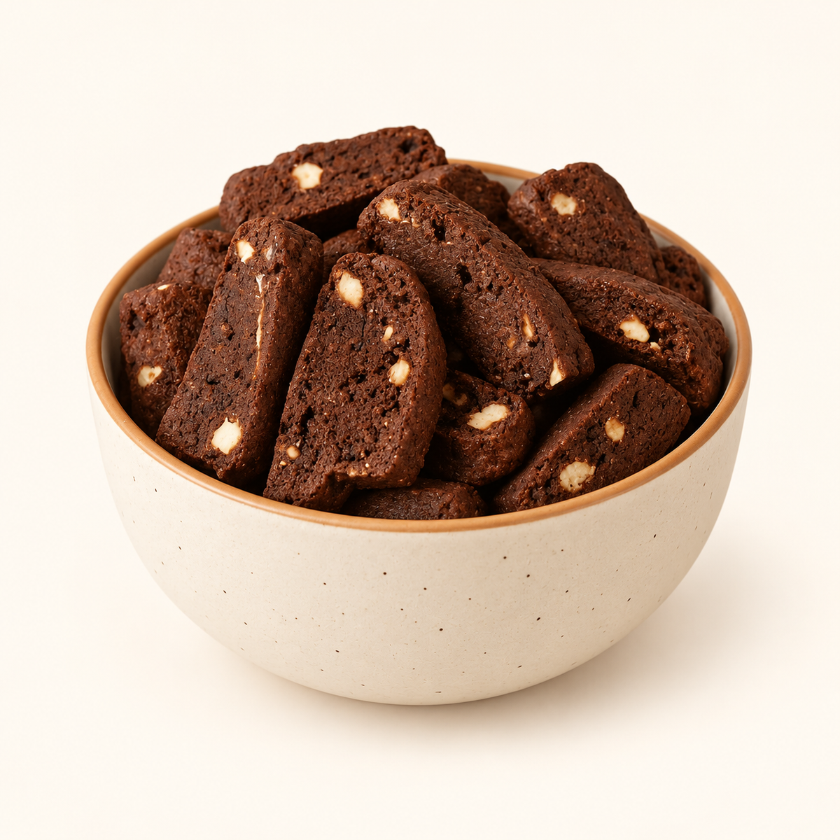 Mocha Hazelnut Biscotti in an ivory bowl on an off-white background