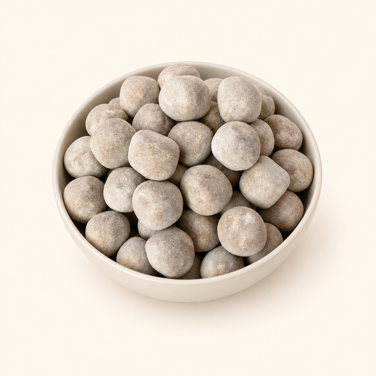 Ram Laddu in a bowl on an off-white background