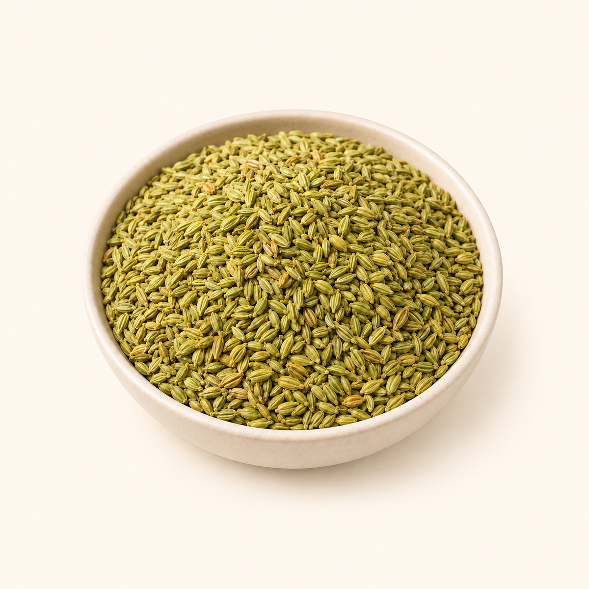 Roasted Fennel Seed in a bowl on an off-white background